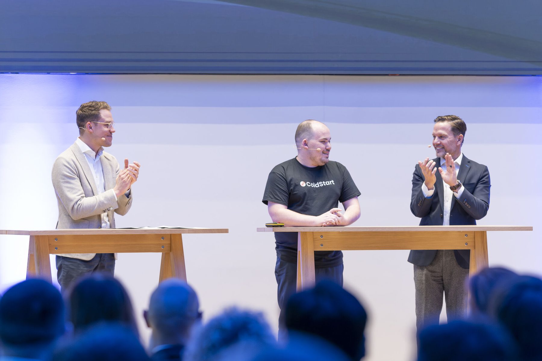 Brandon Teller on stage being applauded after ColdStart was announced as challenge winner